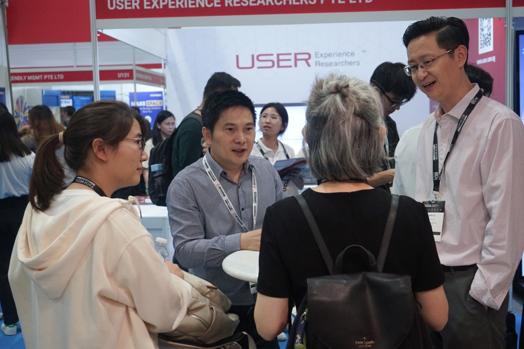 USER CEO Dr Frank Qiu explaining services to clients